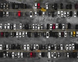 a parking lot filled with lots of parked cars
