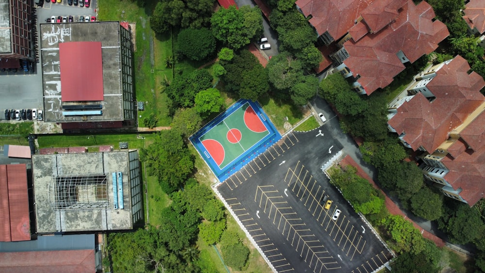 an aerial view of a basketball court in a parking lot