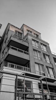 Wide shot of a multi-story commercial building with balconies.