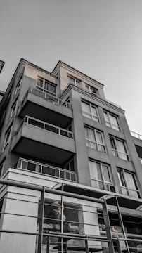 Wide angle of a multi-unit apartment building exterior after pressure washing, looking fresh and inviting.