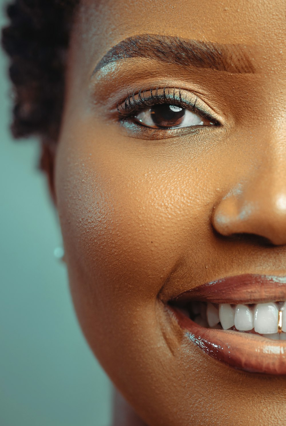 a close up of a woman with a smile on her face