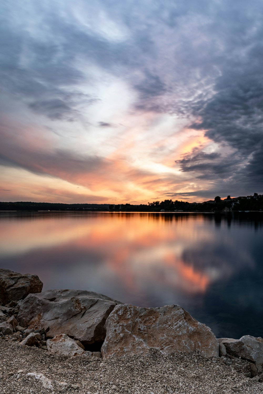 a large body of water surrounded by rocks