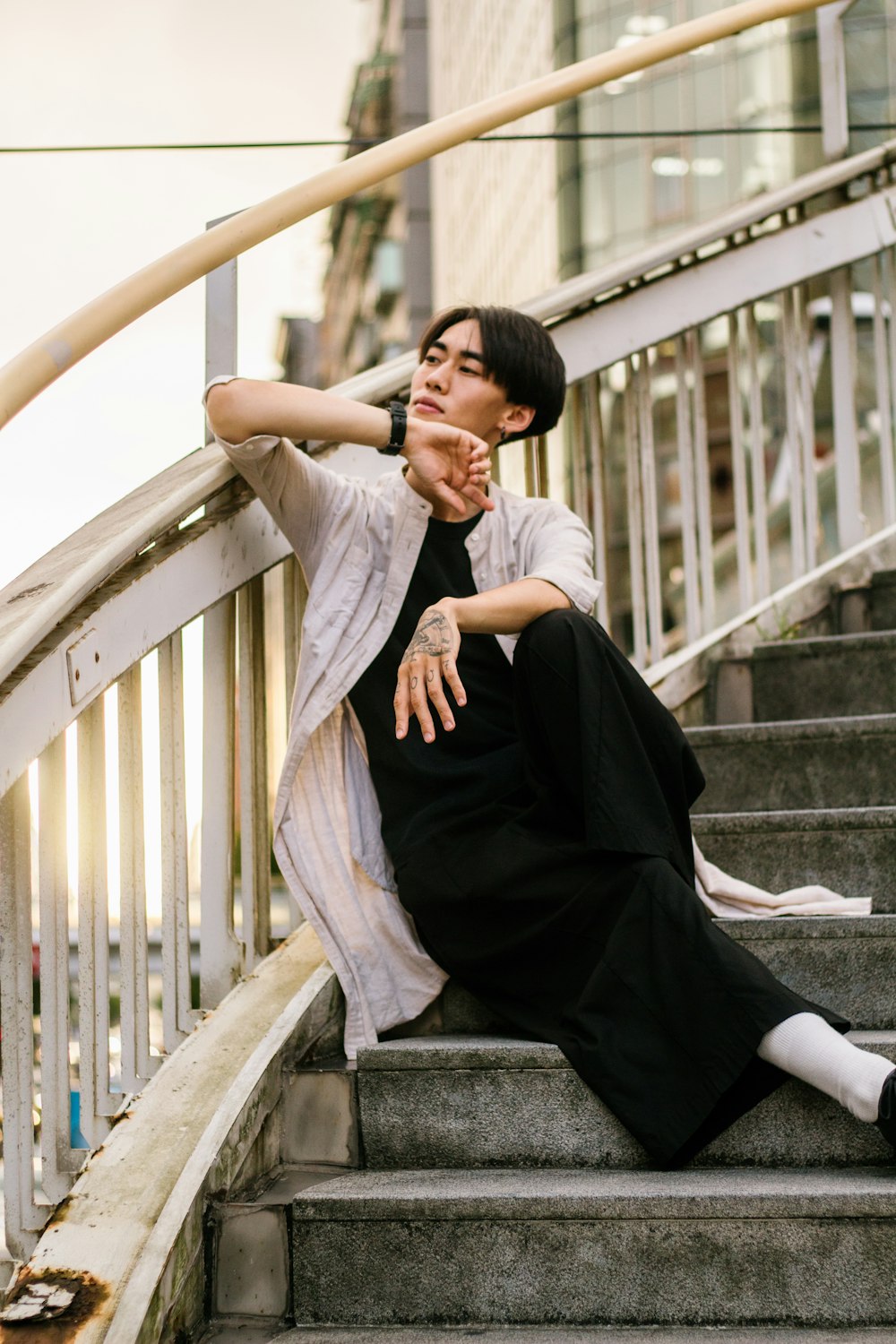 a woman sitting on a set of stairs