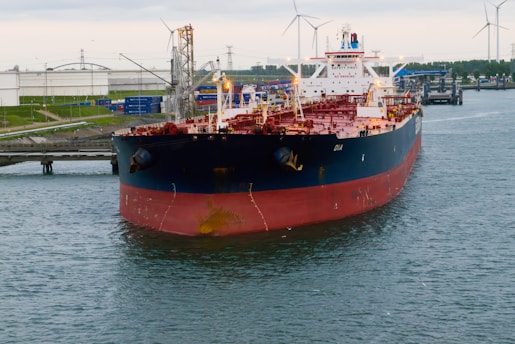 a large boat floating on top of a body of water