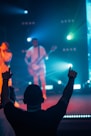 a group of people standing on top of a stage