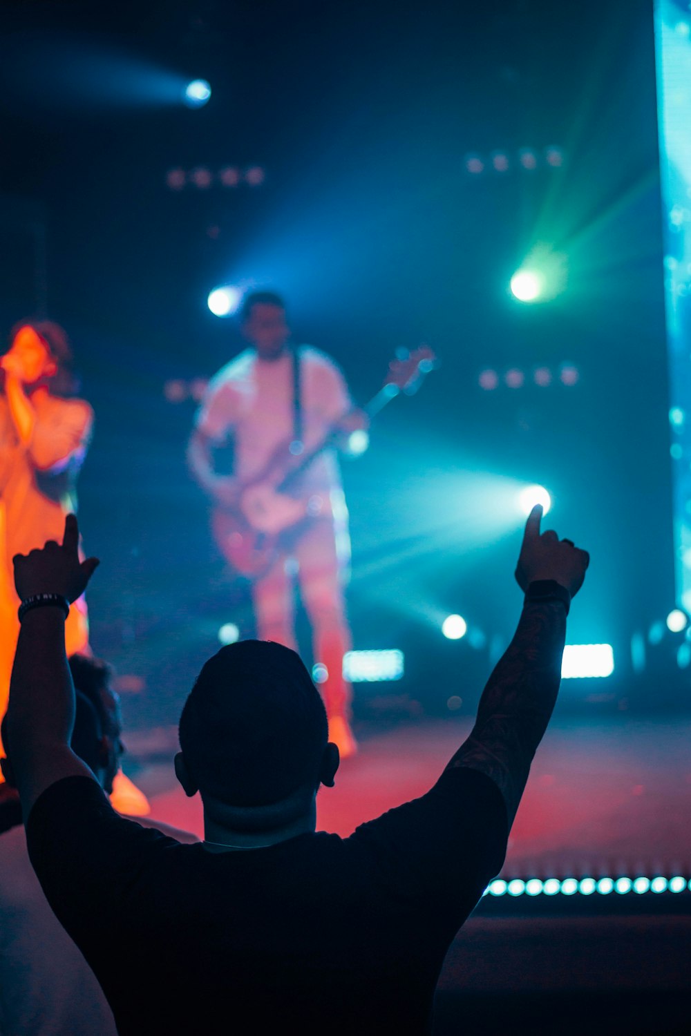 a group of people standing on top of a stage