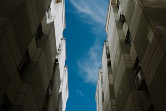 a couple of tall buildings sitting next to each other
