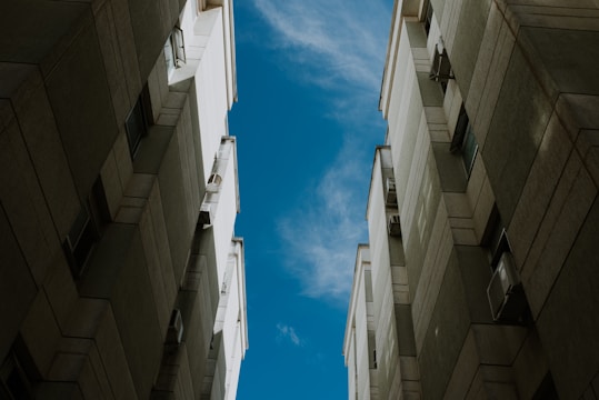 a couple of tall buildings sitting next to each other