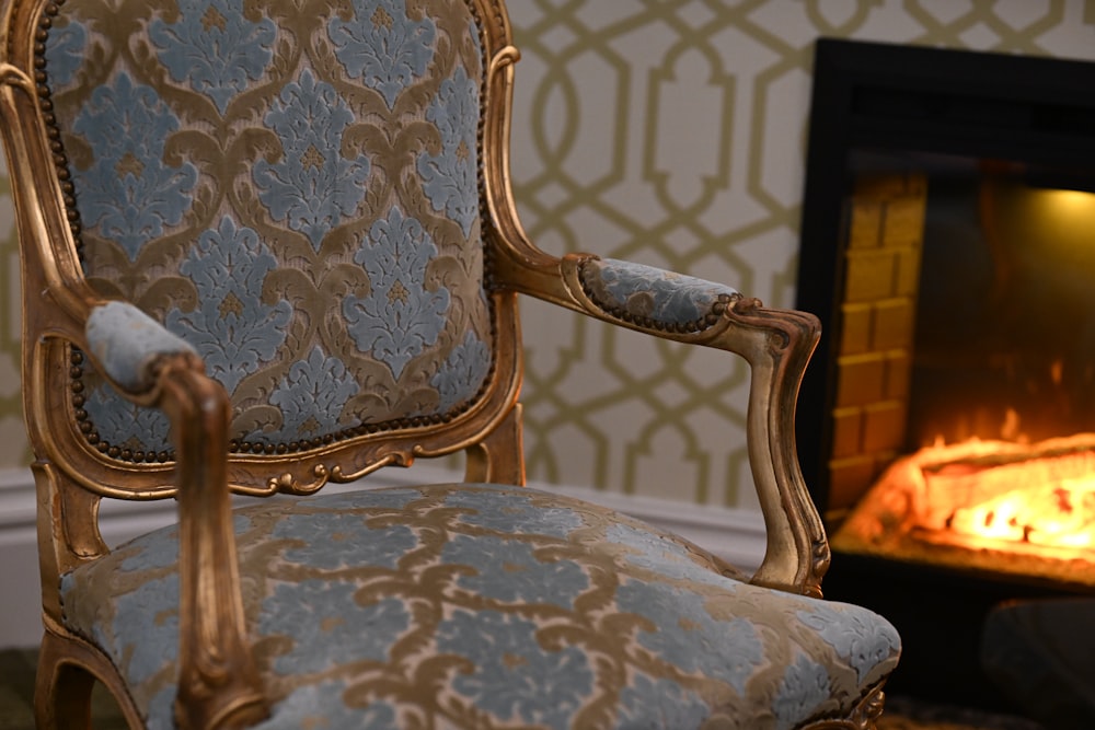 a chair sitting in front of a fire place