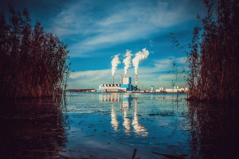 a factory with smoke coming out of it's stacks