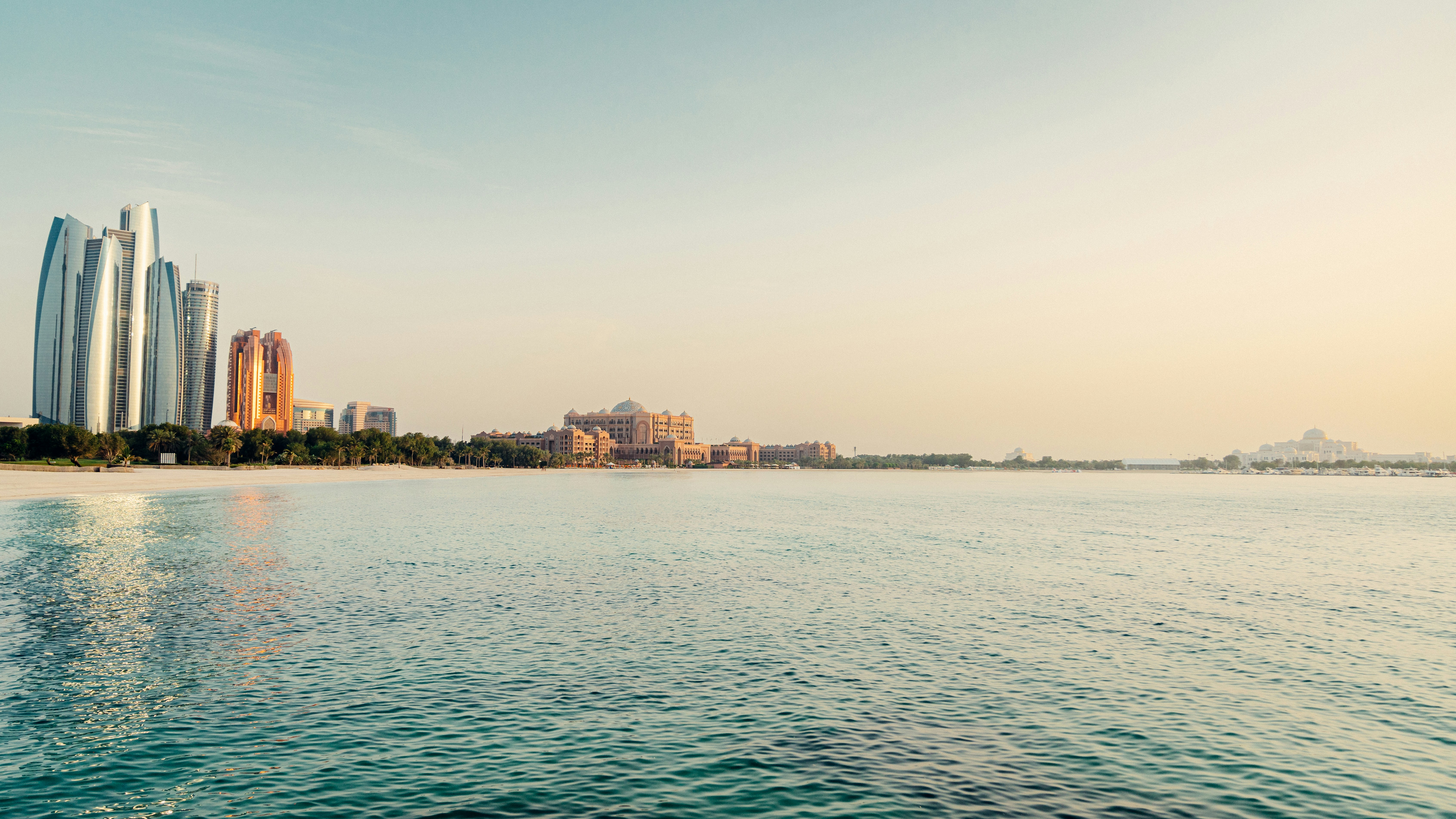 a body of water with buildings in the background