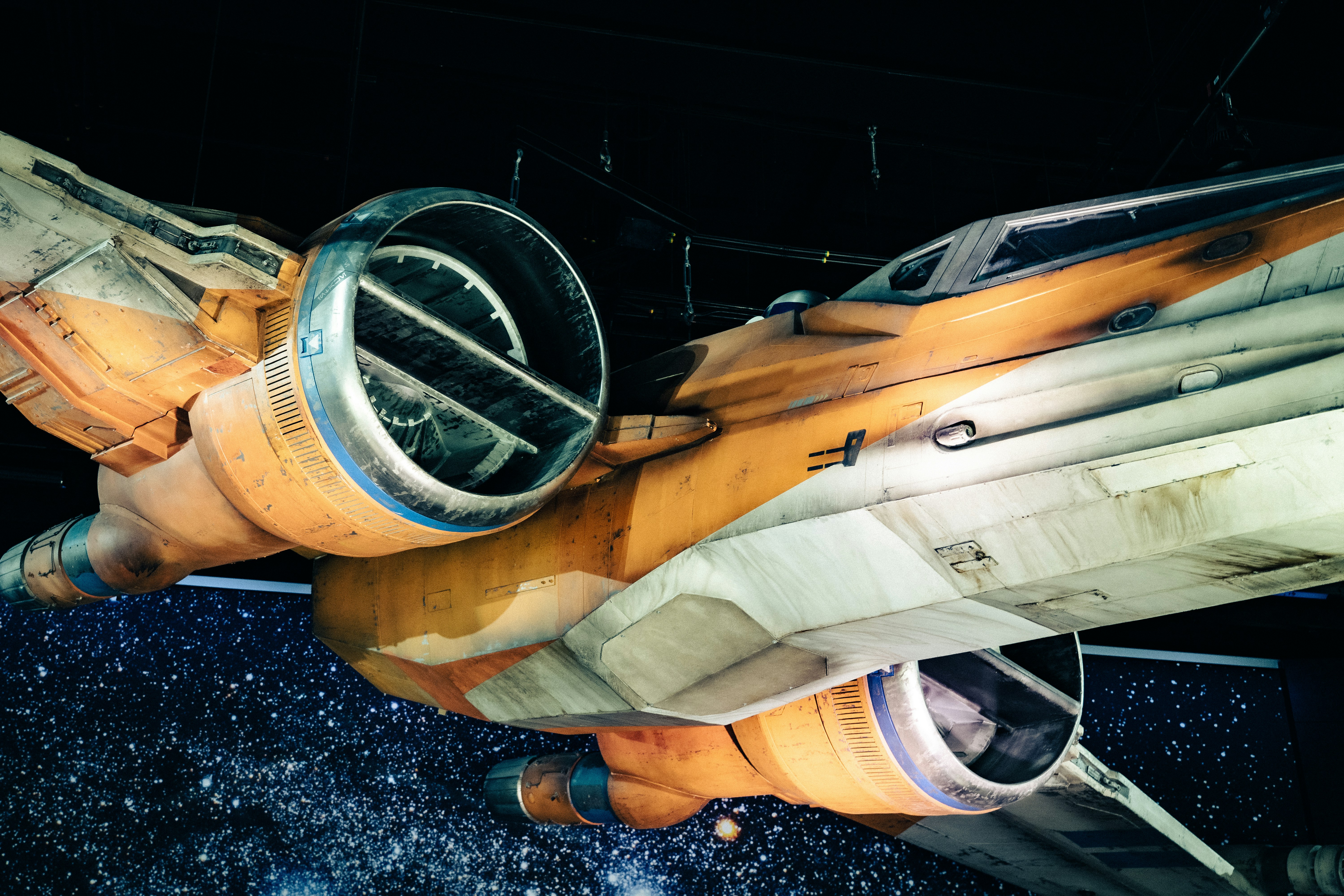 a close up of a fighter jet in a hangar