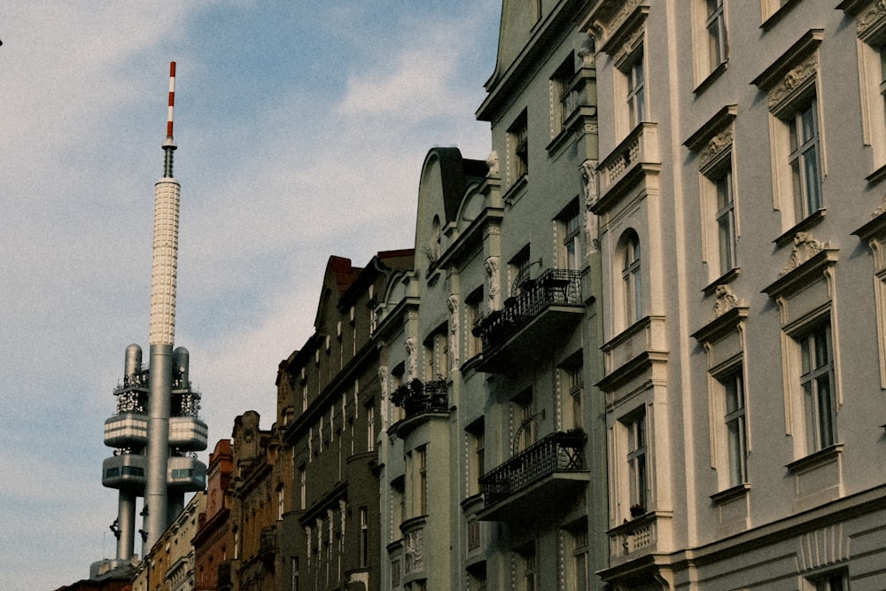 a tall building with a television tower on top of it