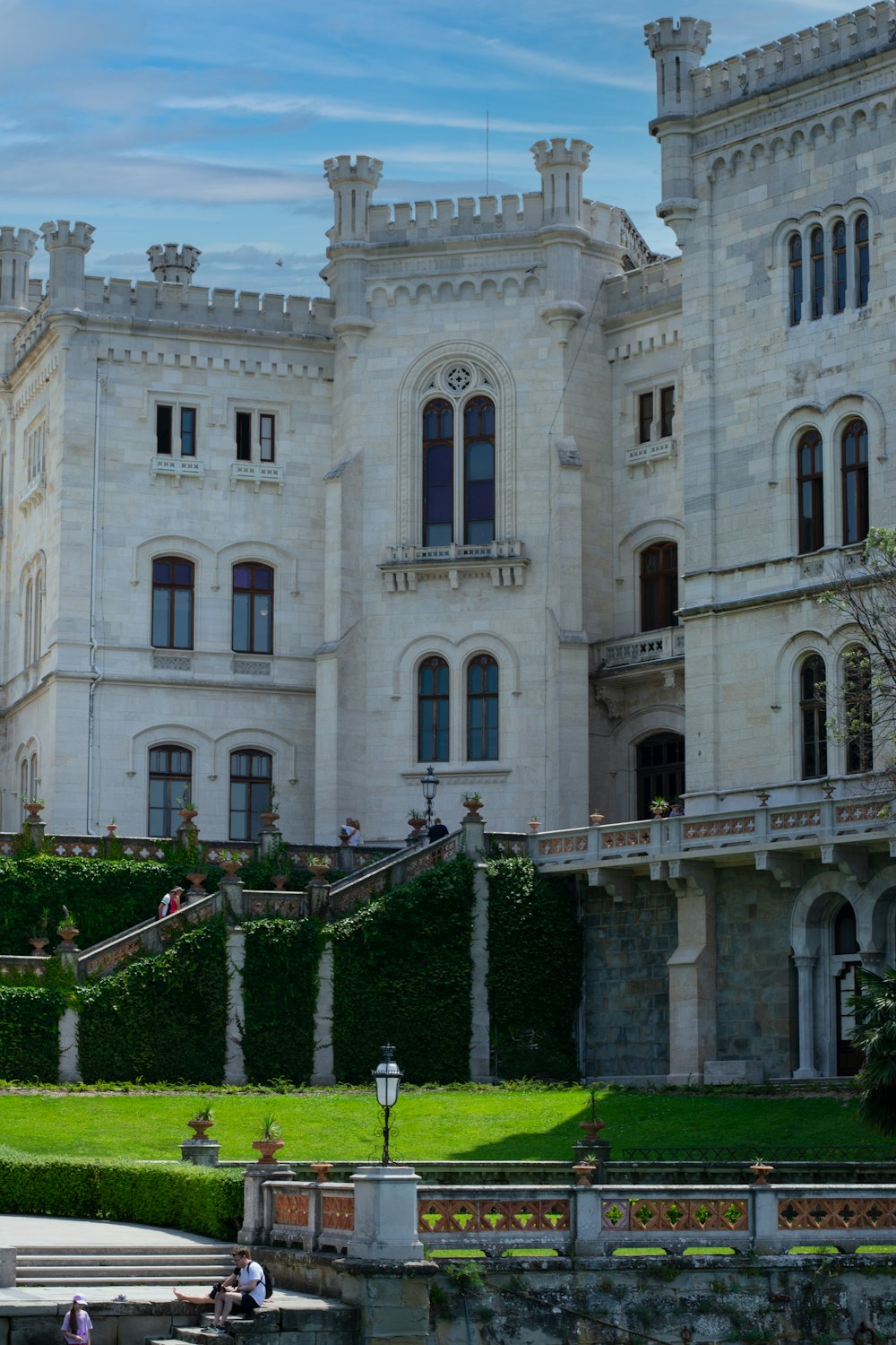 a castle like building with a fountain in front of it