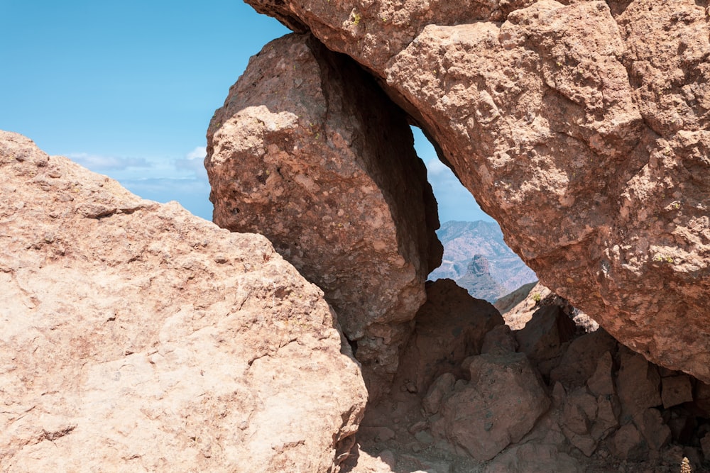 a person standing on top of a large rock