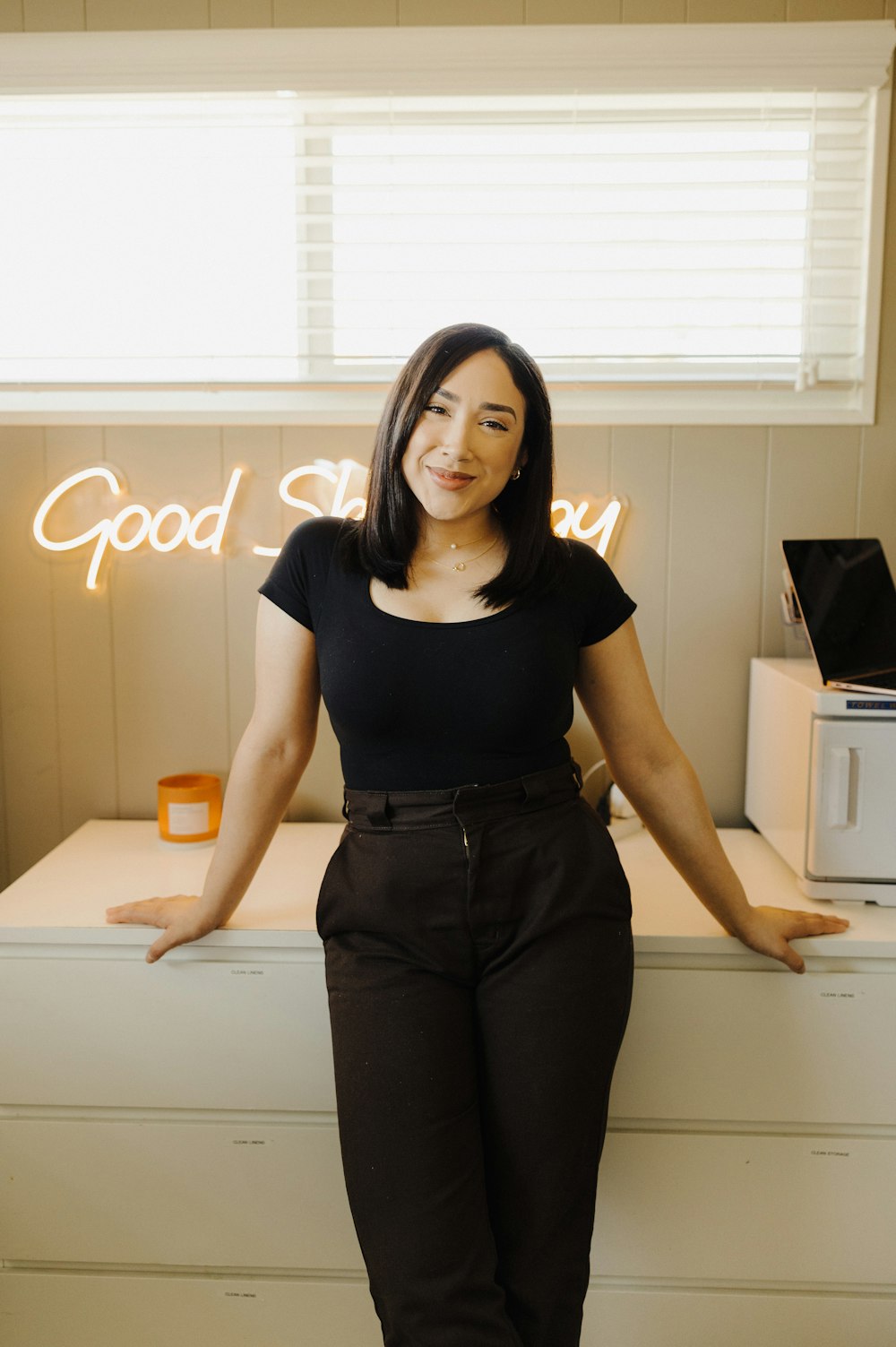 a woman standing in front of a counter