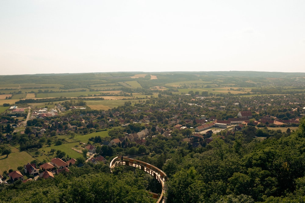 a scenic view of a town and a bridge