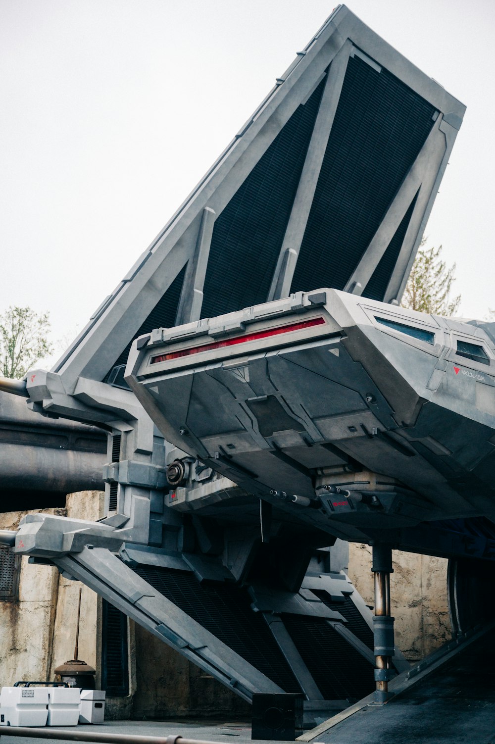 a star wars vehicle parked in front of a building