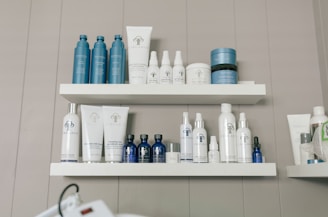 a shelf filled with lots of different types of skin care products