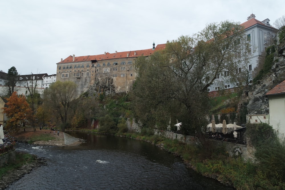 a river running through a city next to tall buildings