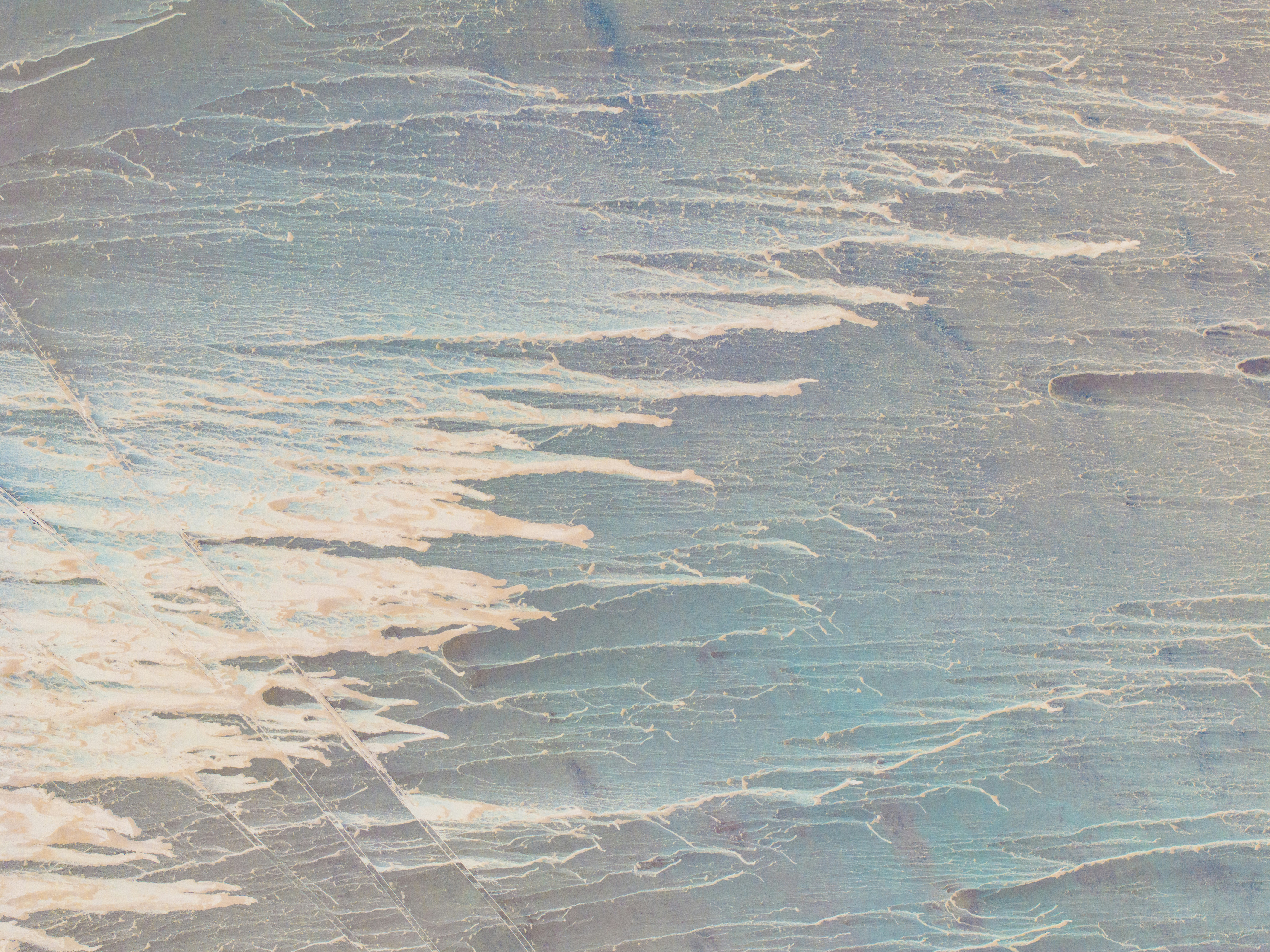 a person on a snowboard in the snow