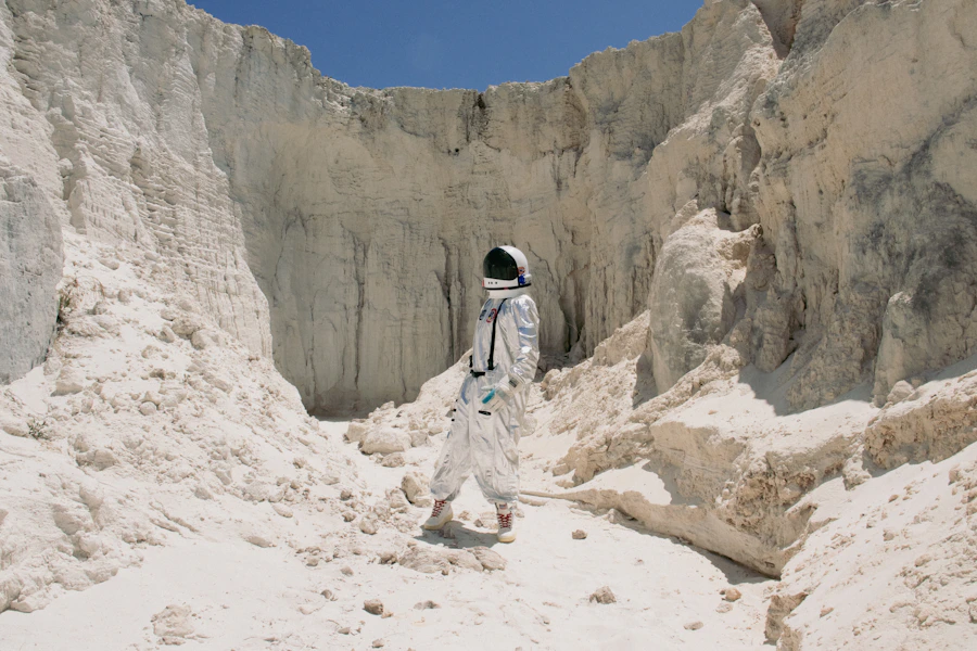 Astronaut walking through a desert landscape