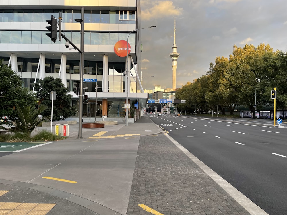 a city street with a traffic light and a tall building