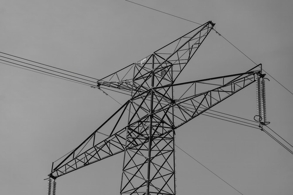 a black and white photo of a power line