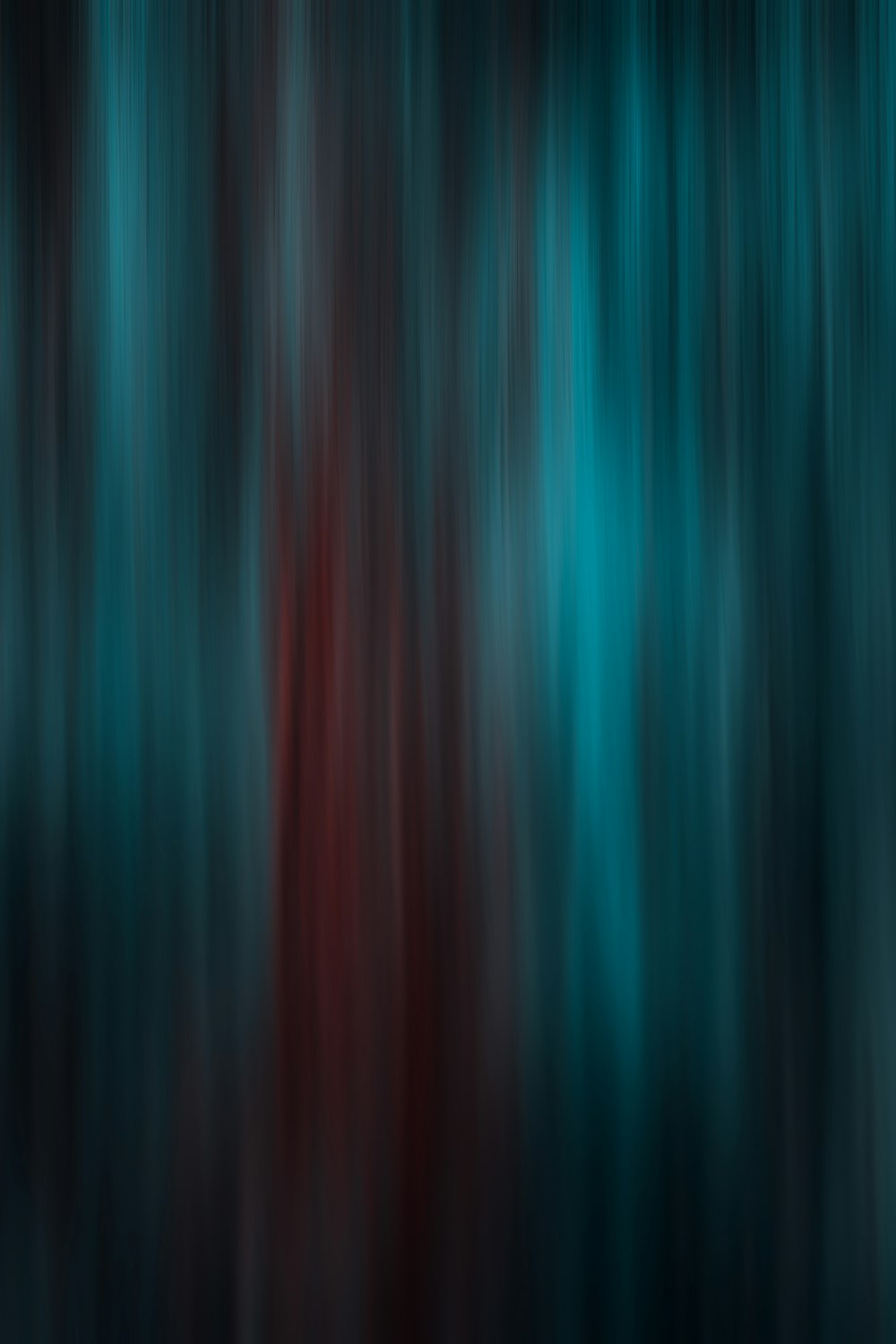 a blurry image of a red and blue forest