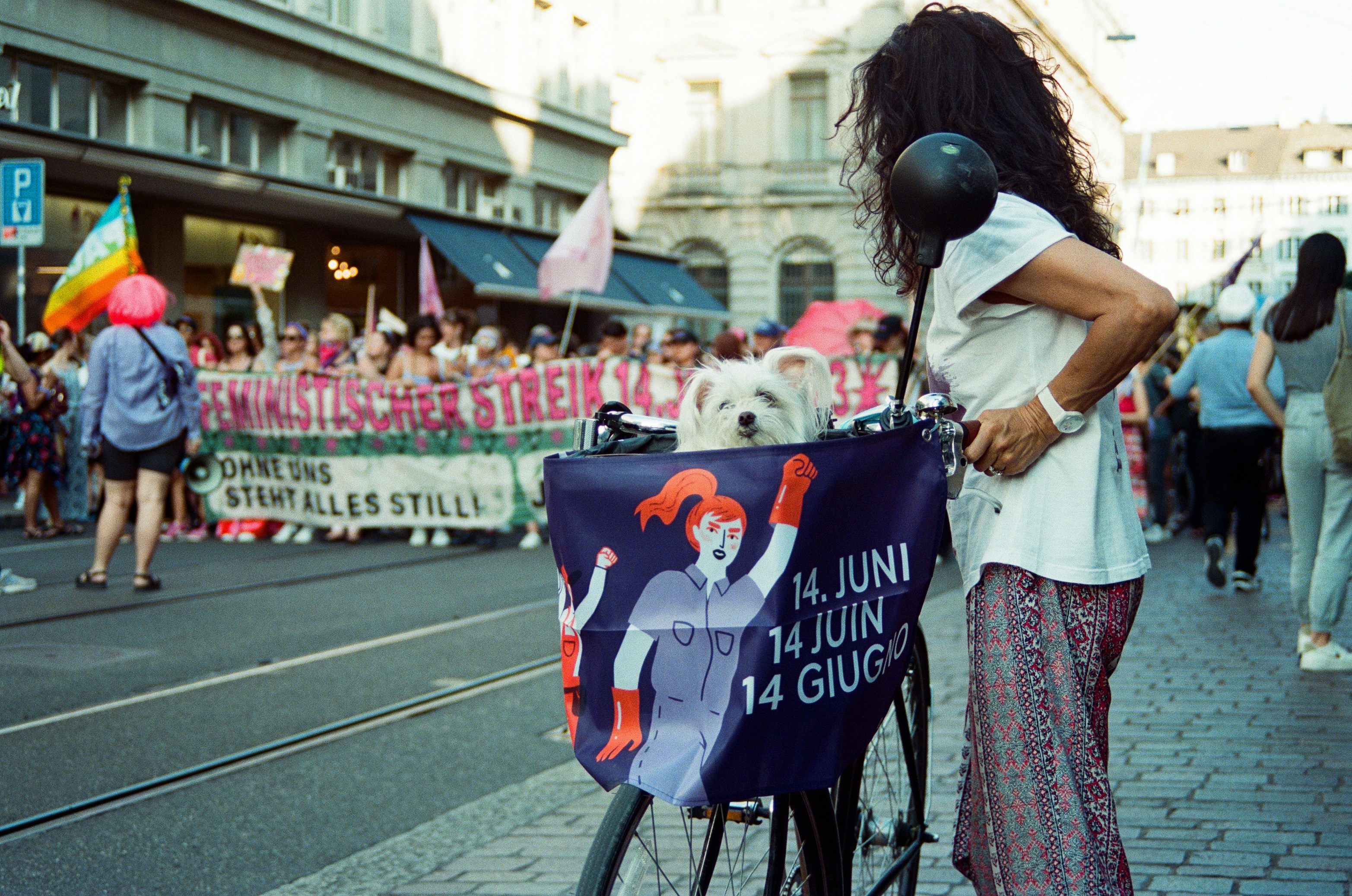 a woman standing next to a bike with a sign on it