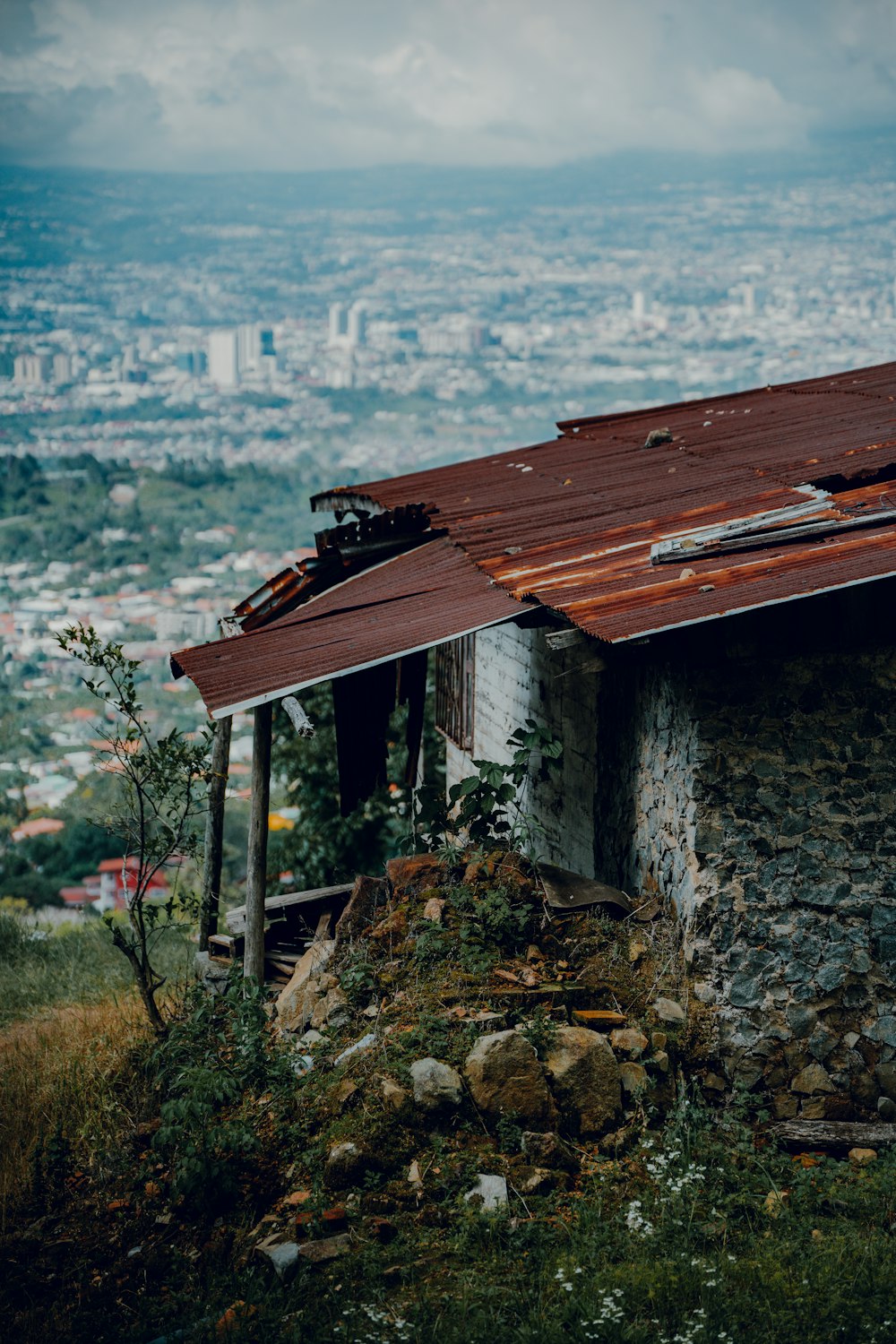 a run down house with a rusty roof