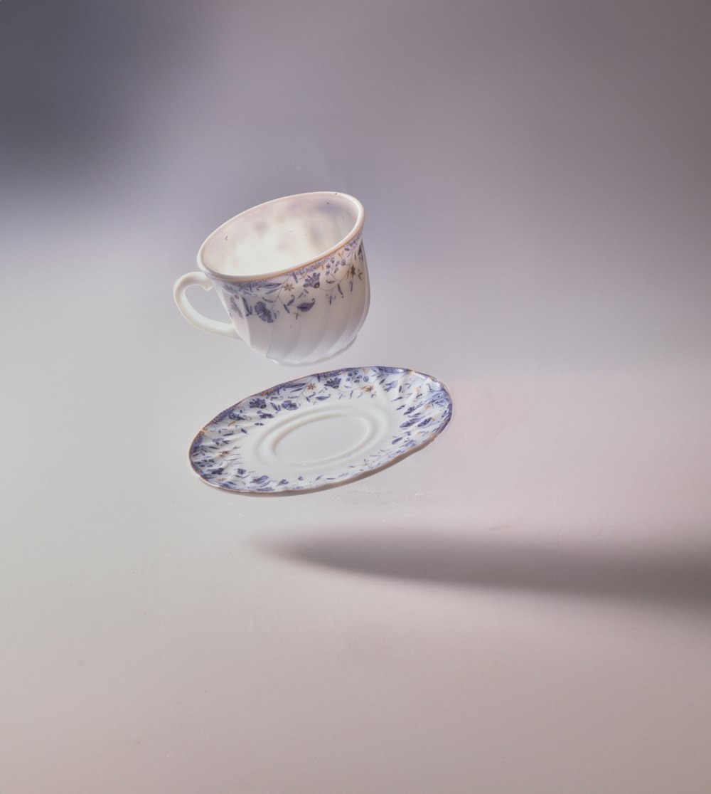 a cup and saucer sitting on a table