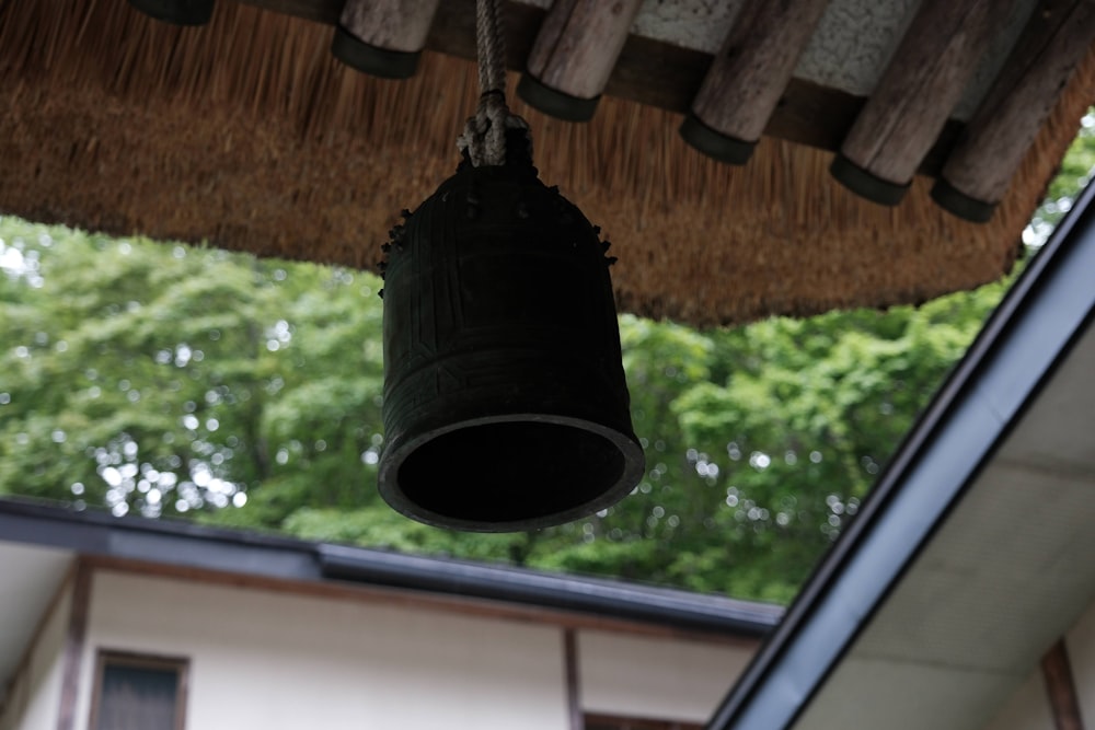 a bell hanging from the ceiling of a house