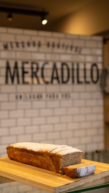 Close-up of golden, freshly made torrijas on a rustic wooden board.