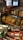 A variety of liquor bottles are displayed on the top shelf, including brands like Johnnie Walker, Gordon’s, and others. Below them, there are several packs of pasta with yellow and green packaging, stacked neatly. The background includes a refrigerated section with drink bottles.