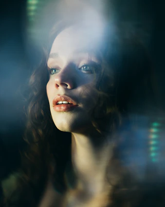 a woman with blue eyes and long hair