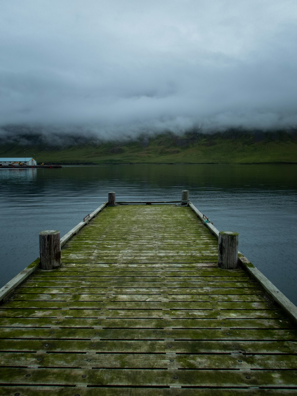 a wooden dock on a body of water