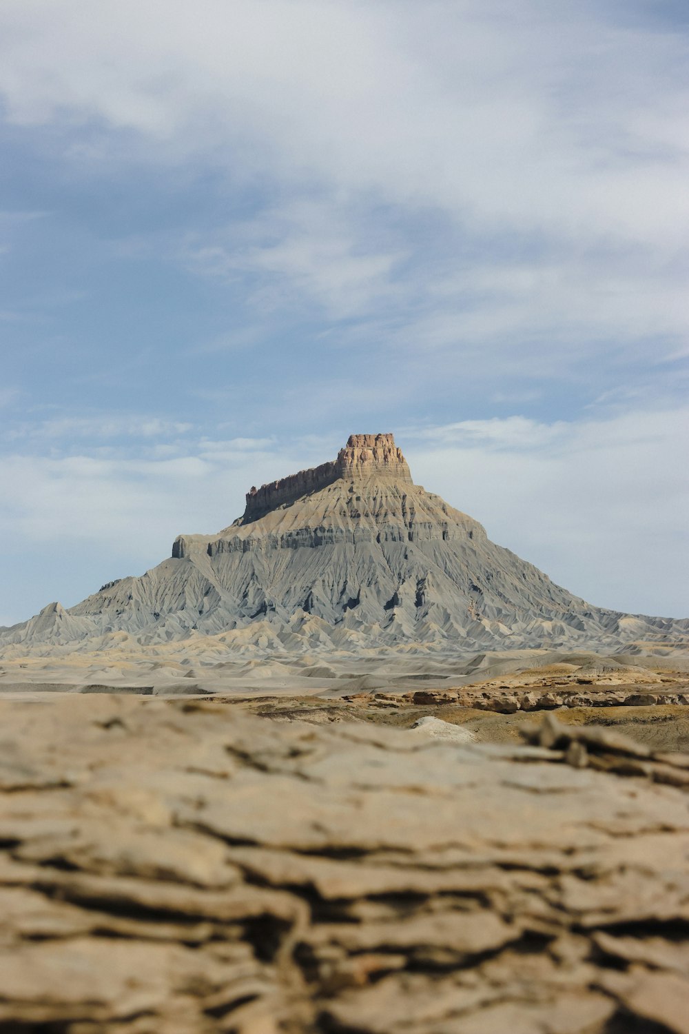 a large rock formation in the middle of a desert