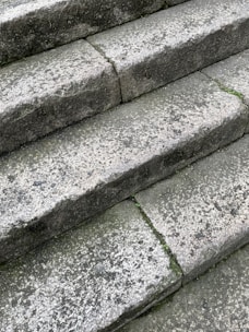 Before and after images of a restored outdoor granite step showing vibrant color and smooth texture.