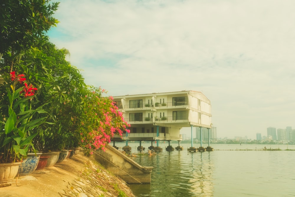 a large body of water with a building in the background