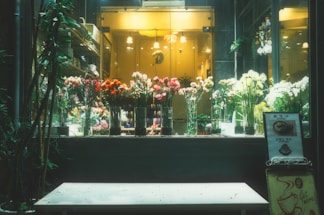 A beautiful floral arrangement displayed in a cozy shop.