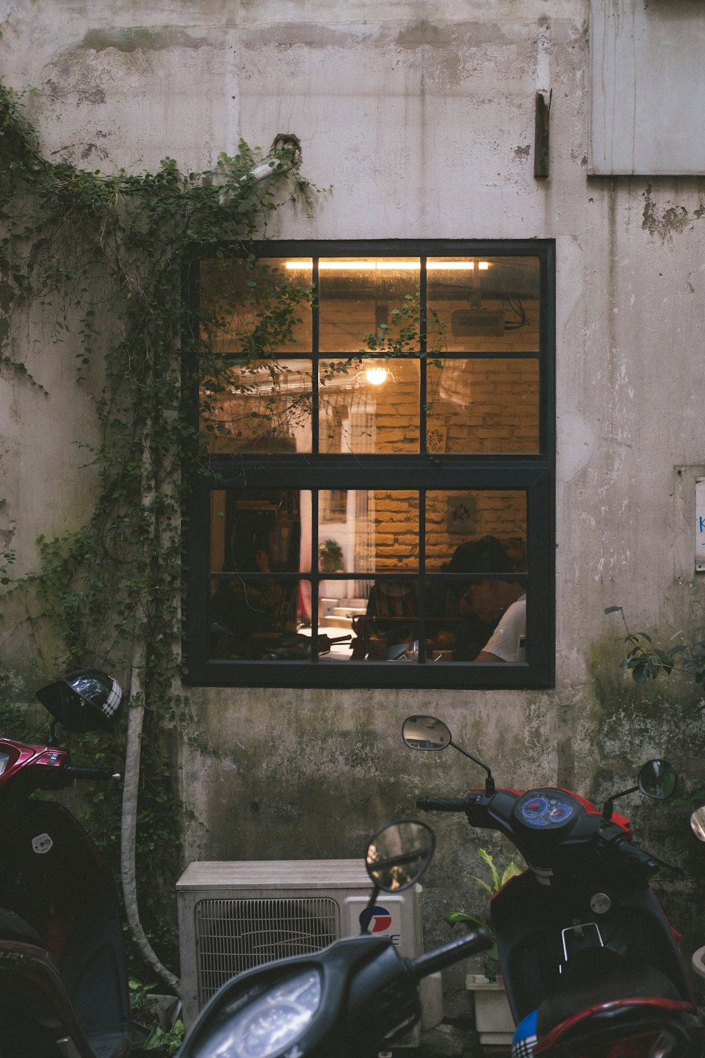 a couple of motorcycles parked in front of a building