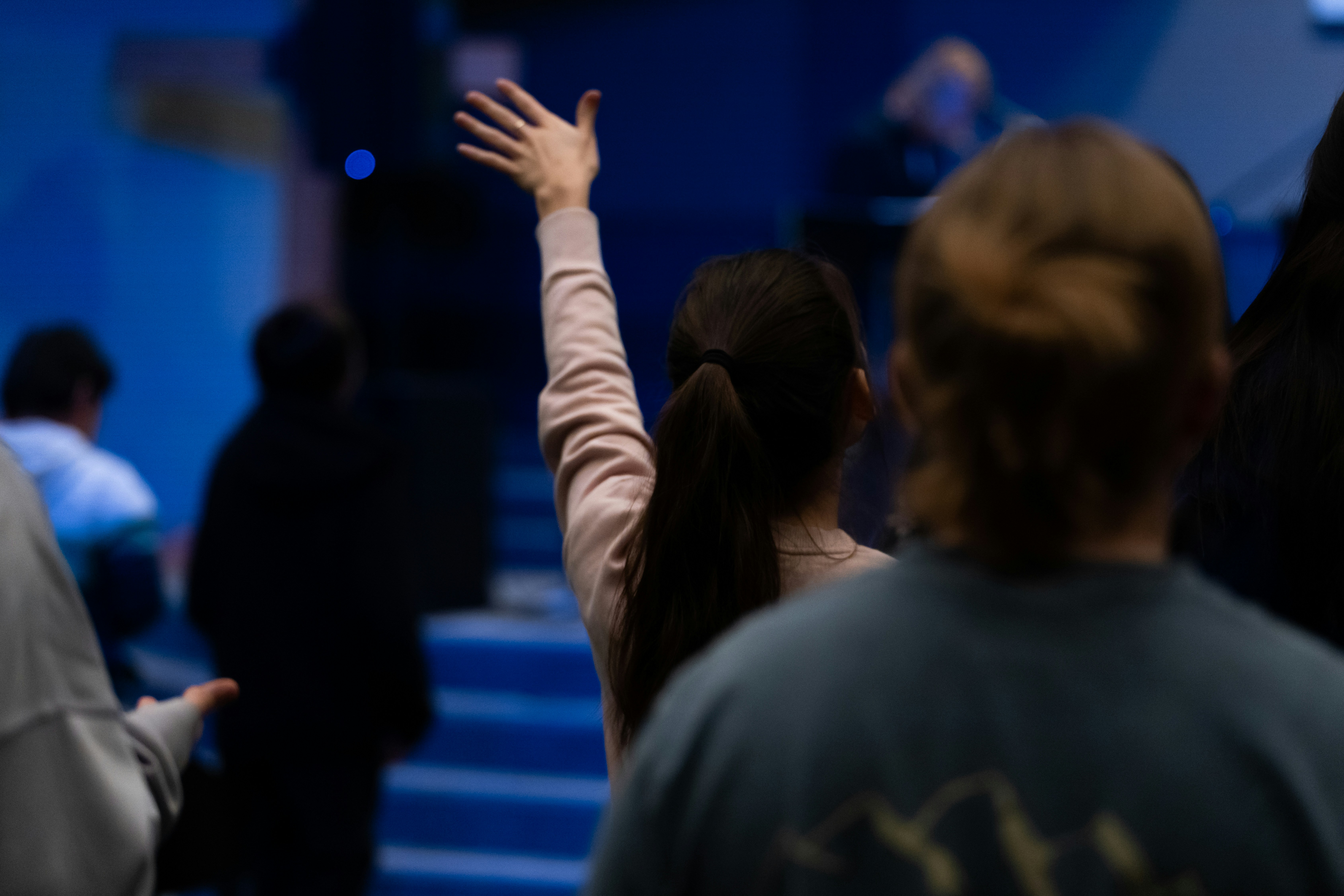 a group of people standing around each other