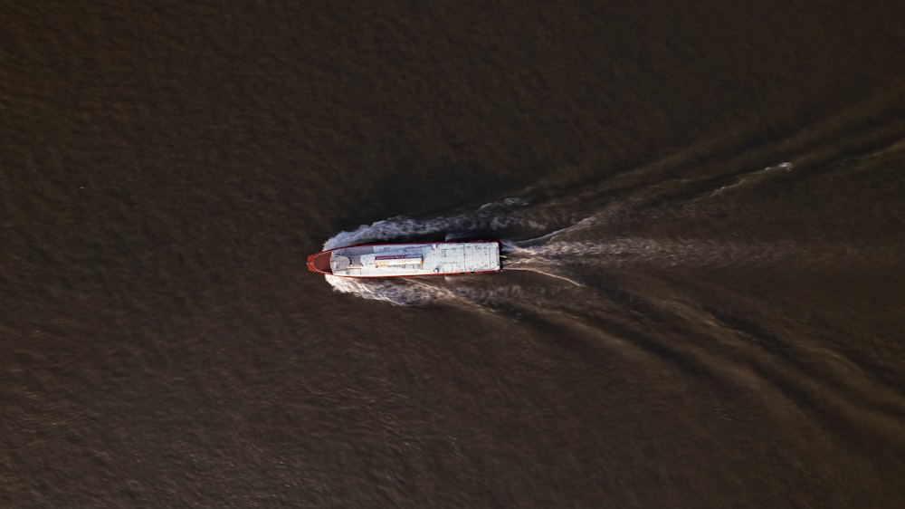 a small boat traveling through a body of water