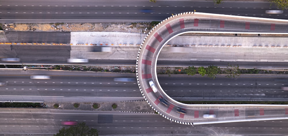 an aerial view of a highway with a curved road