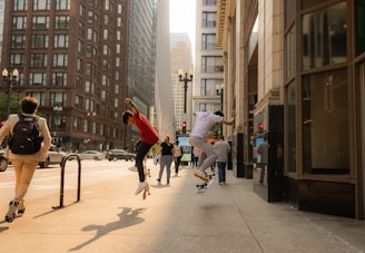 a group of people riding skateboards down a street