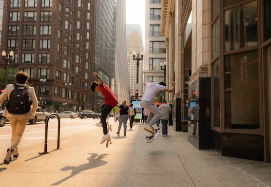 a group of people riding skateboards down a street