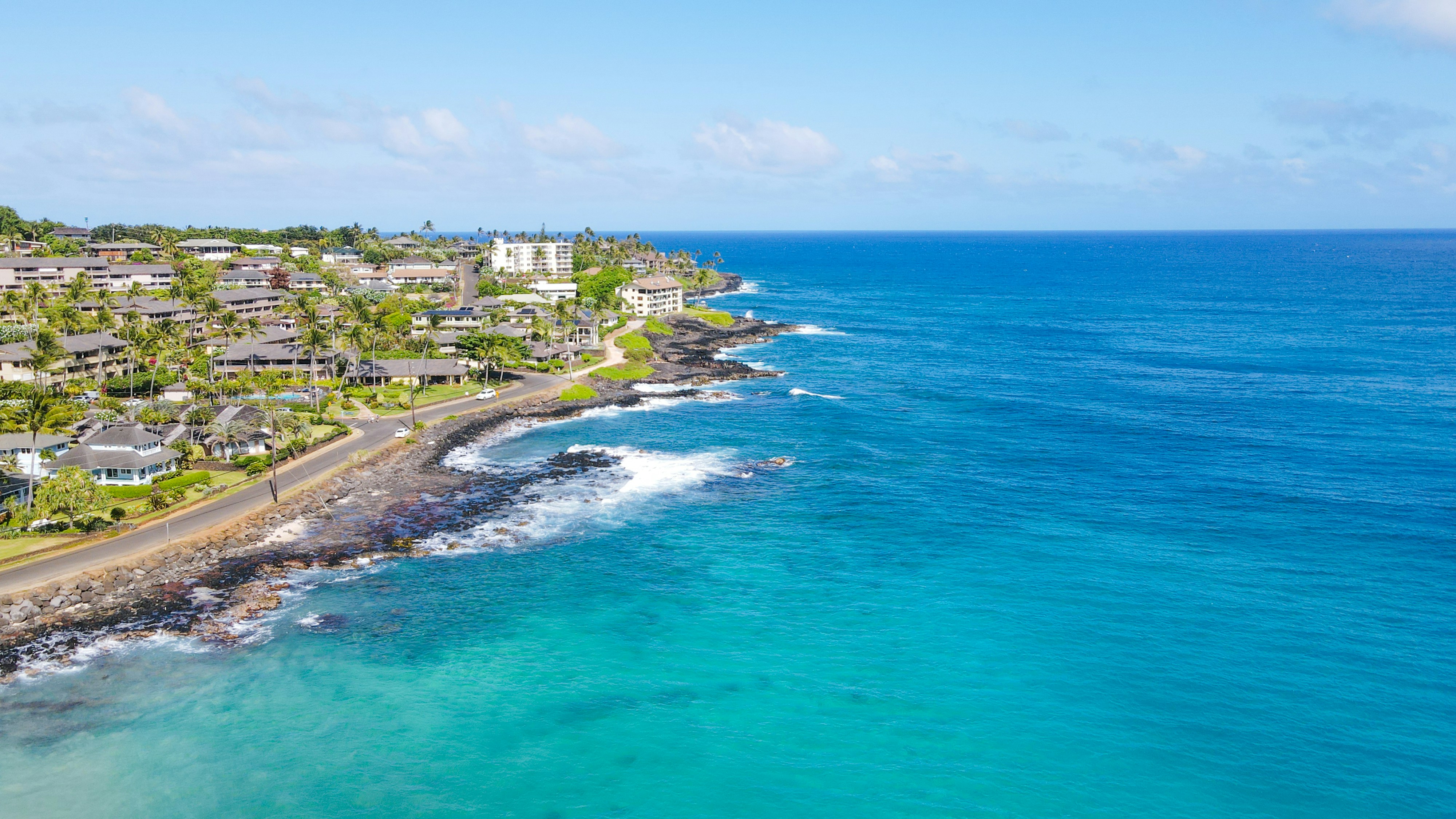 an aerial view of a beach with houses on it