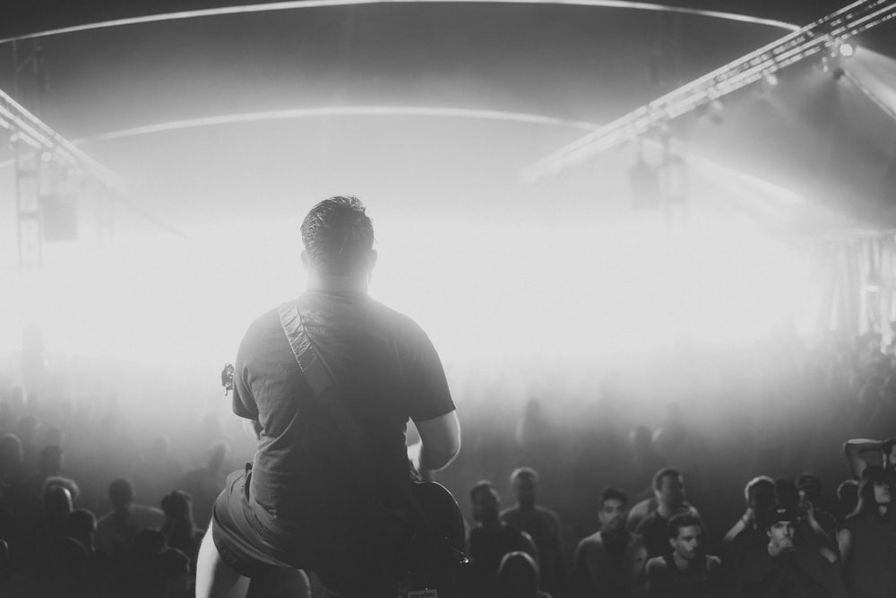 a man standing in front of a crowd of people