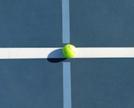 A line judge attentively watching the ball during a crucial point in the game.